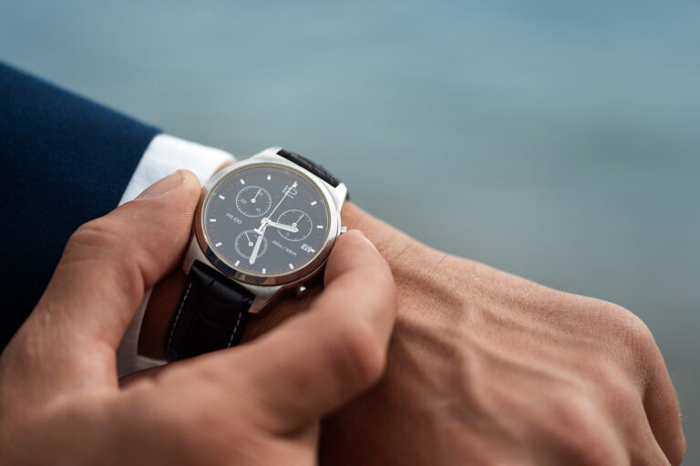 a man adjusting a high-value watch